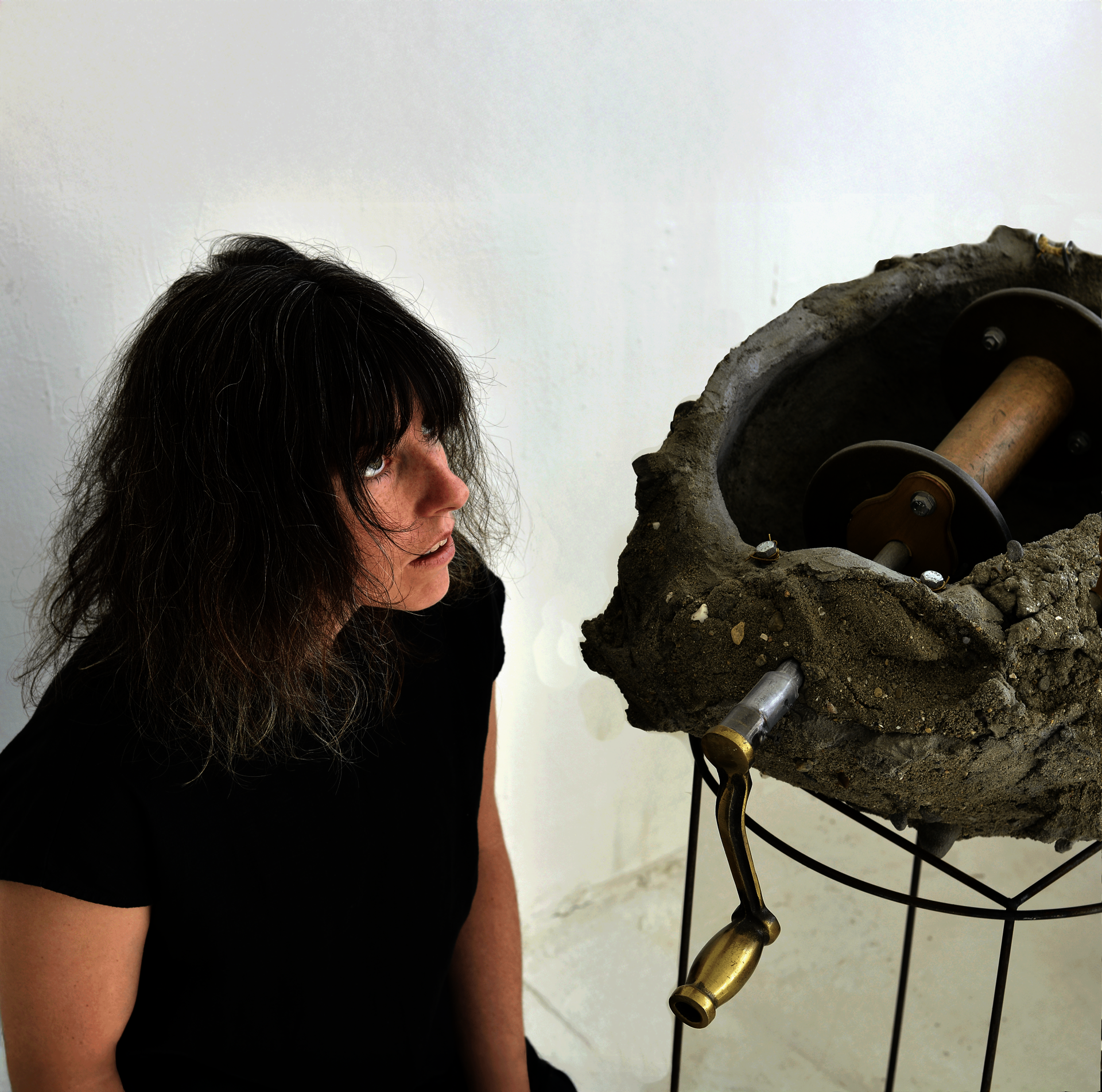 concrete object and vocalist sitting next to it