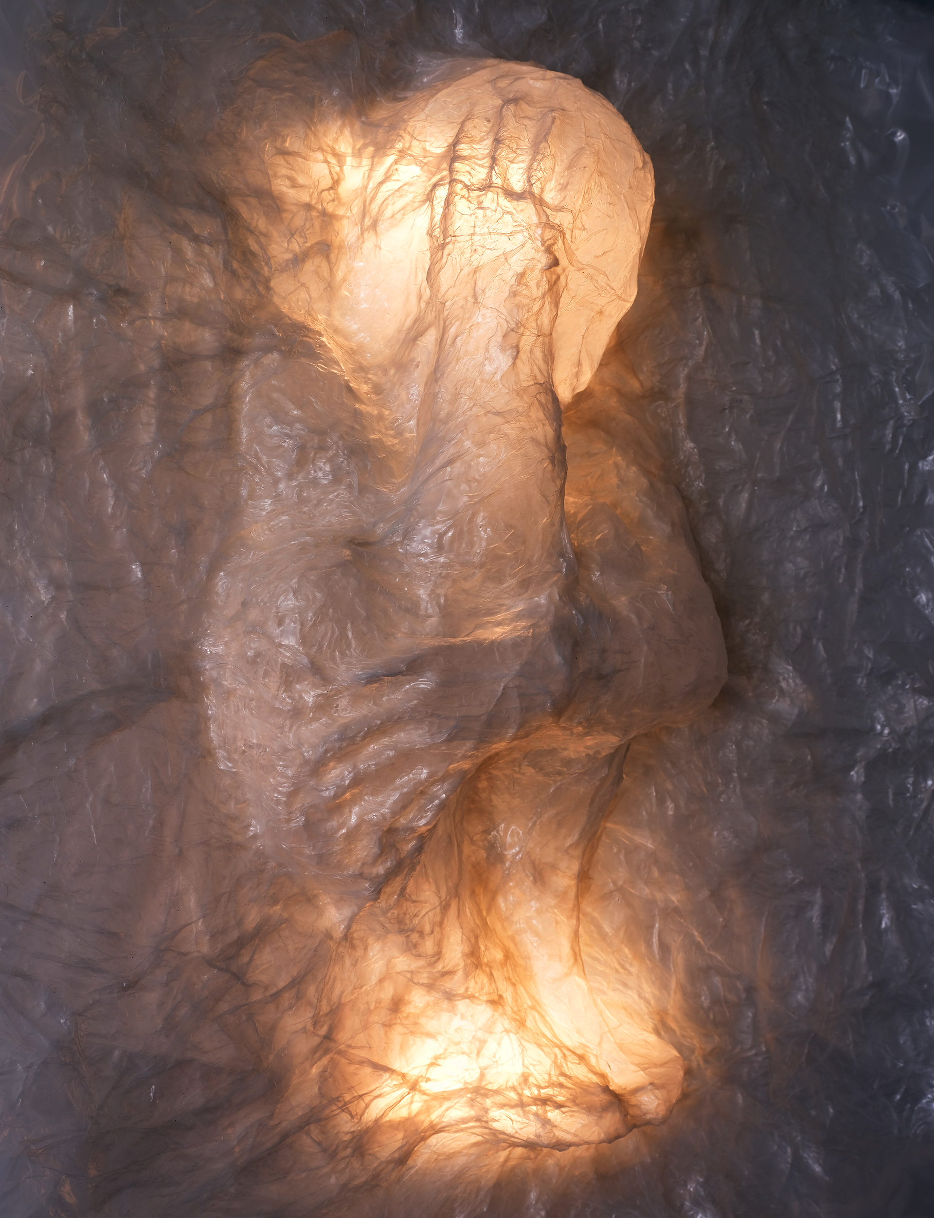 plastic in the shape of a crouched figure
