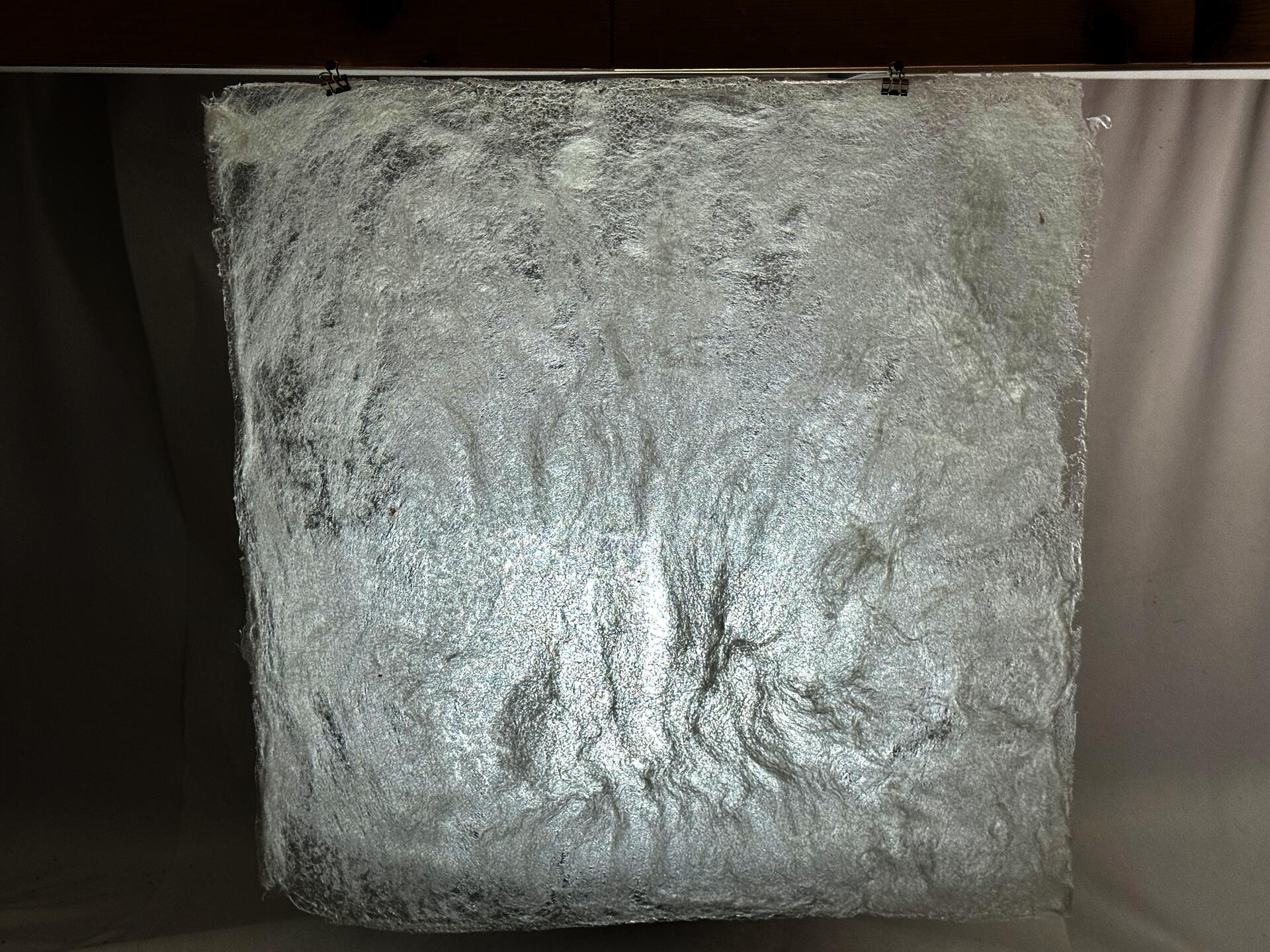 Sheets of material made from a small amount of wool and methylcellulose. 21 inches by 21 inches. The translucent texture allows light to easily enter the “shelter”—the final design—from the front and above, while blocking out some distractions.