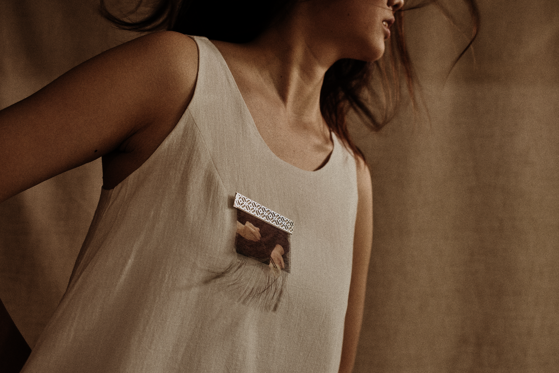 white tank top with fabric broach