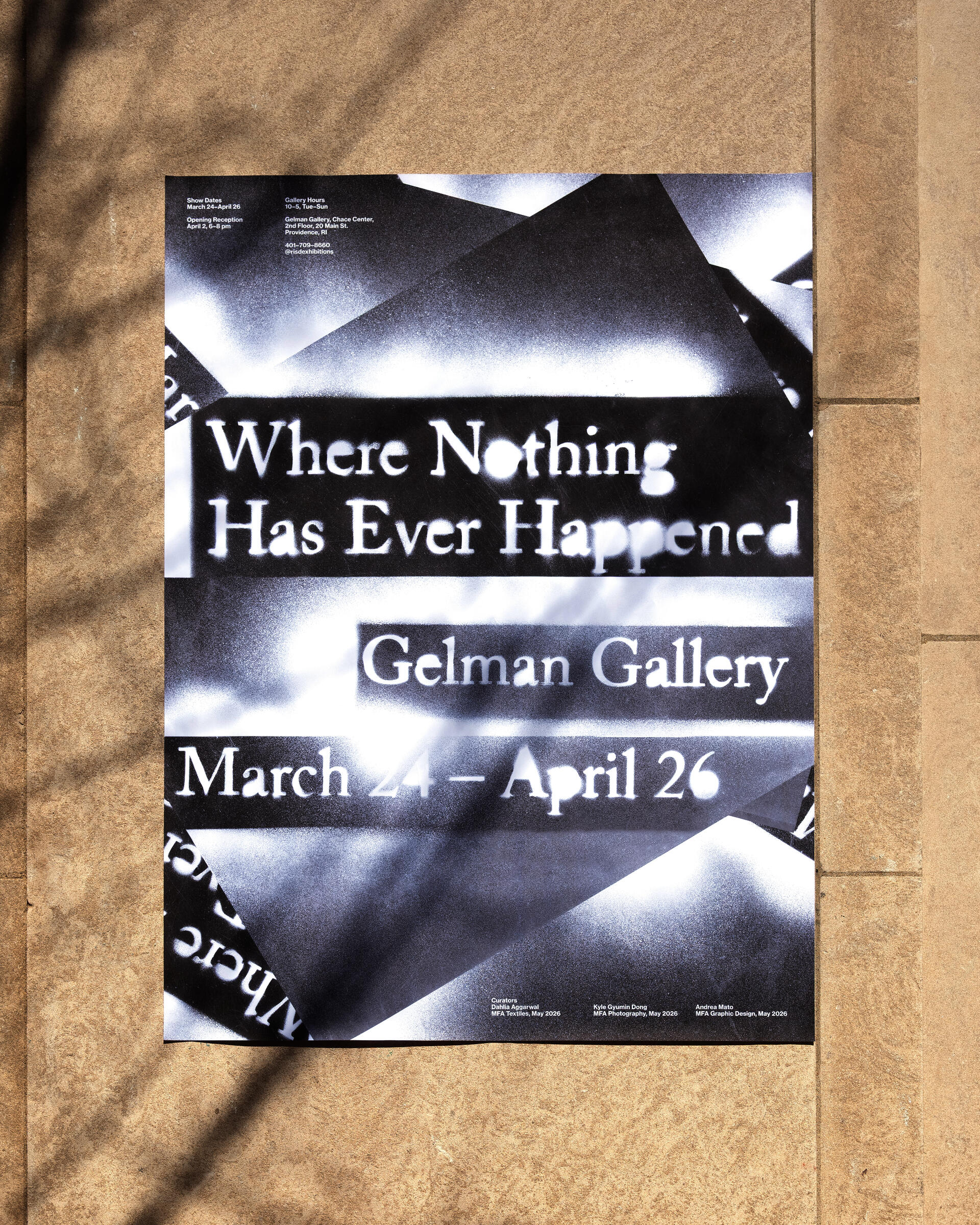 A black-and-white exhibition poster pinned to a stone wall, with leaf shadows cast across it. The poster reads "Where Nothing Has Ever Happened / Gelman Gallery / March 24 – April 26,"
