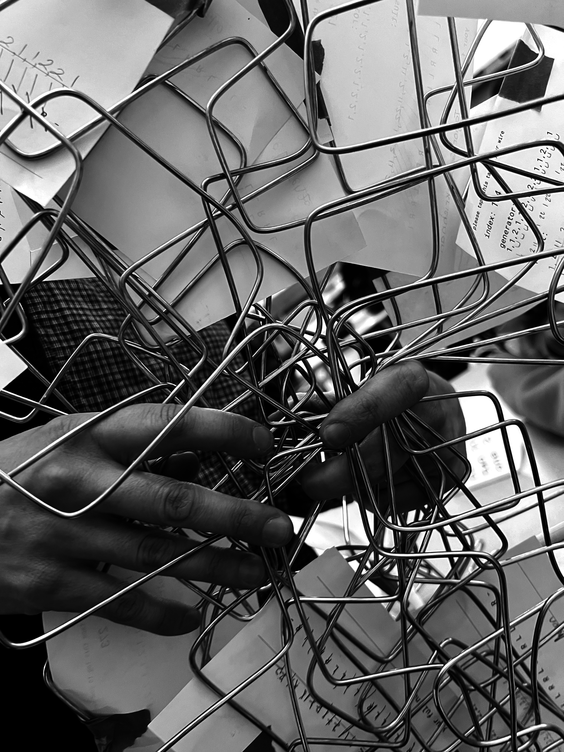 Hands holding folded wires