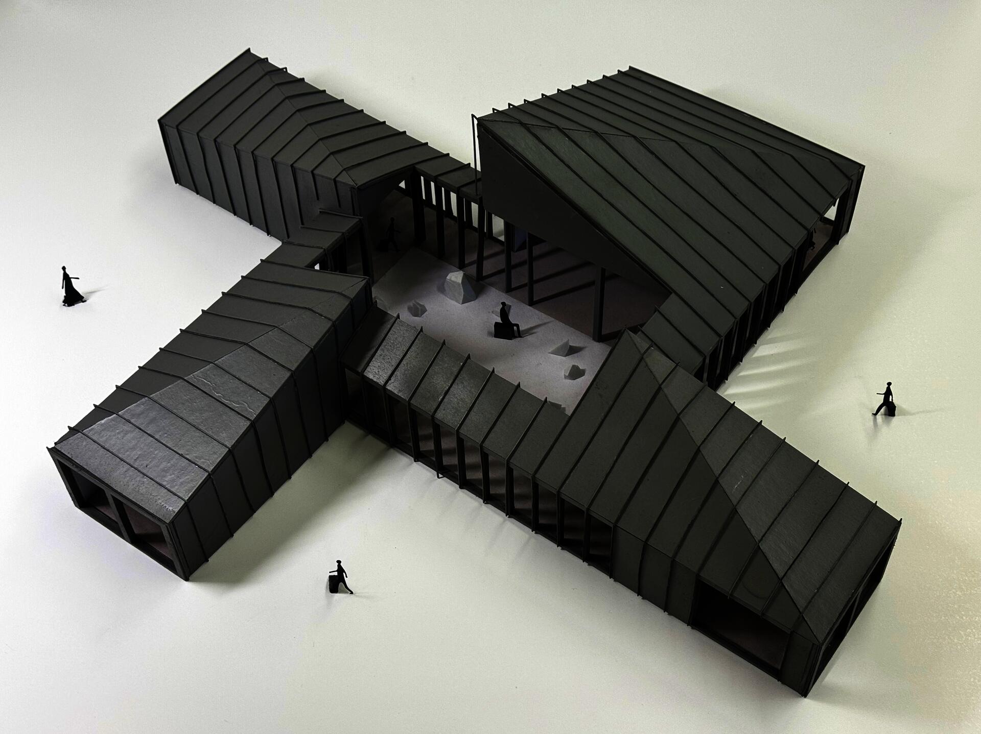 Images of architectural model of house with single sloped roofs.