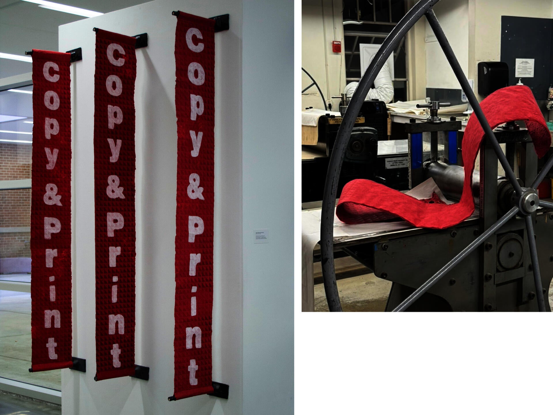 Three long red banners hang vertically on a white wall, each displaying the words ‘copy & print’ in large white letters. The banners are made of textured handmade paper and attached to black wall mounts