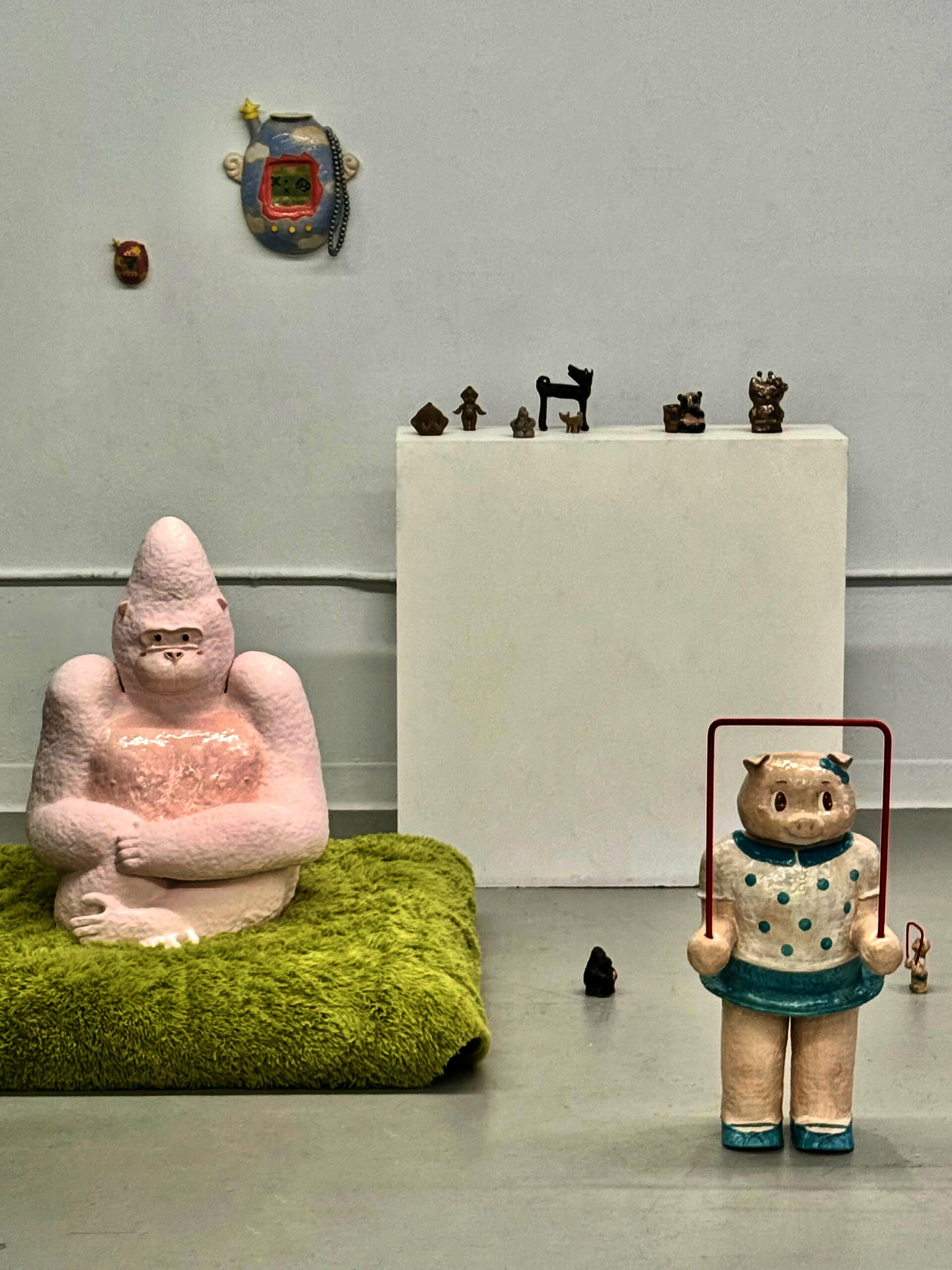 Enlarged pink gorilla toy. Playful form referencing childhood toy. 
