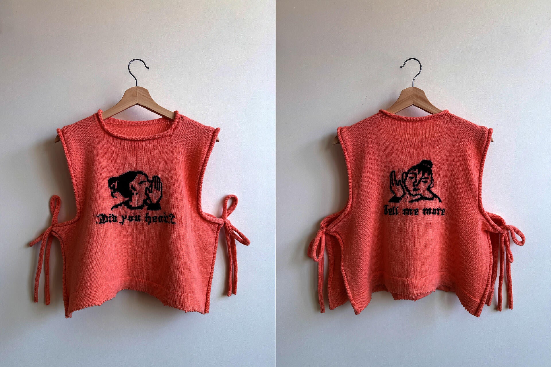 Two bright pink knitted vests side by side both with an image and text knitted in in black yarn. Left image is the front of the vest, it says "Did you hear?" with an icon