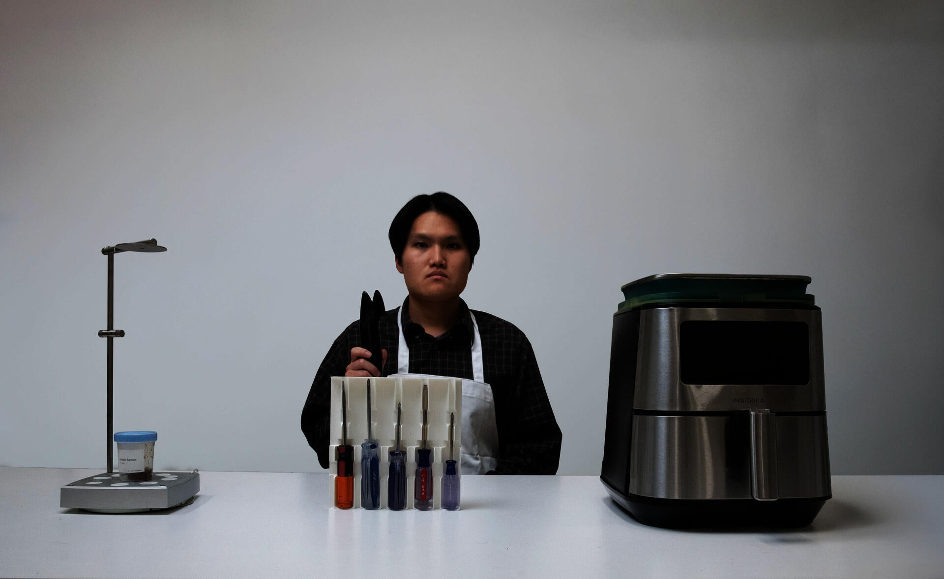 Shot of individual amongst the Boring Objects Bureau's experiments