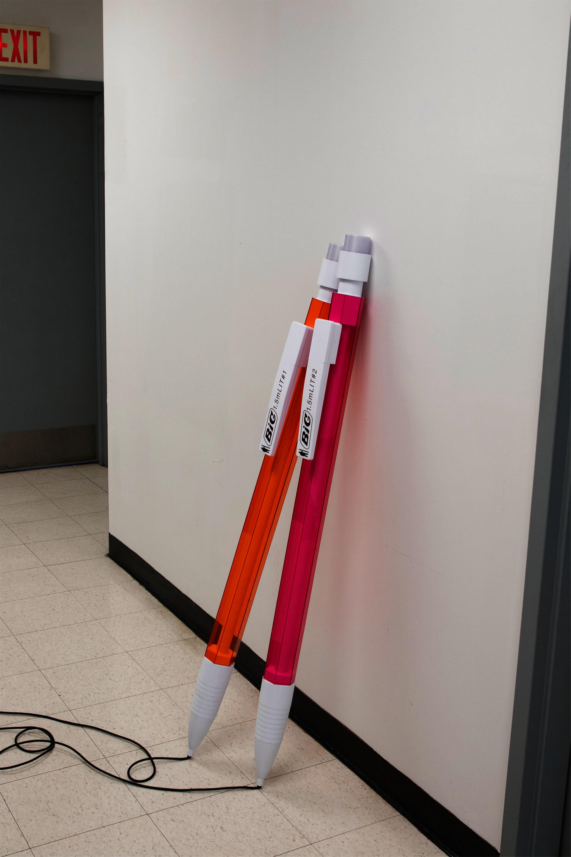 An oversized mechanical pencil reimagined as a light, with a cord extending like graphite lead. You press down the eraser to turn the light on and off. 
