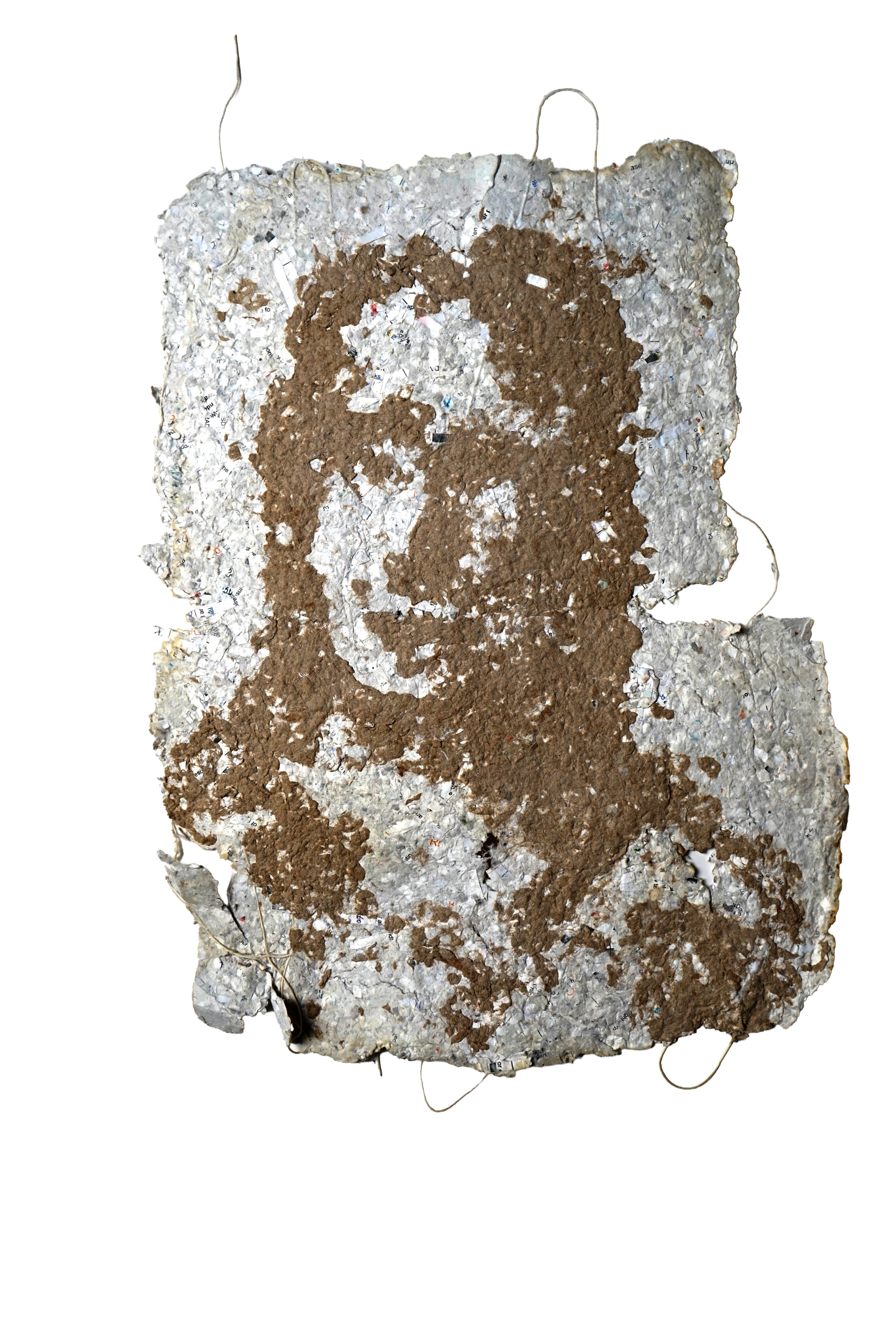 Hand made paper with what appears to be a face applied with different coloured pulp. 