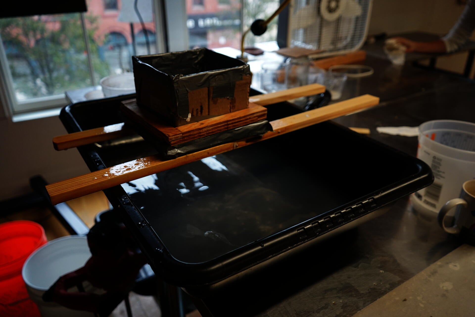 Image of studio working space with paper making equipment. 