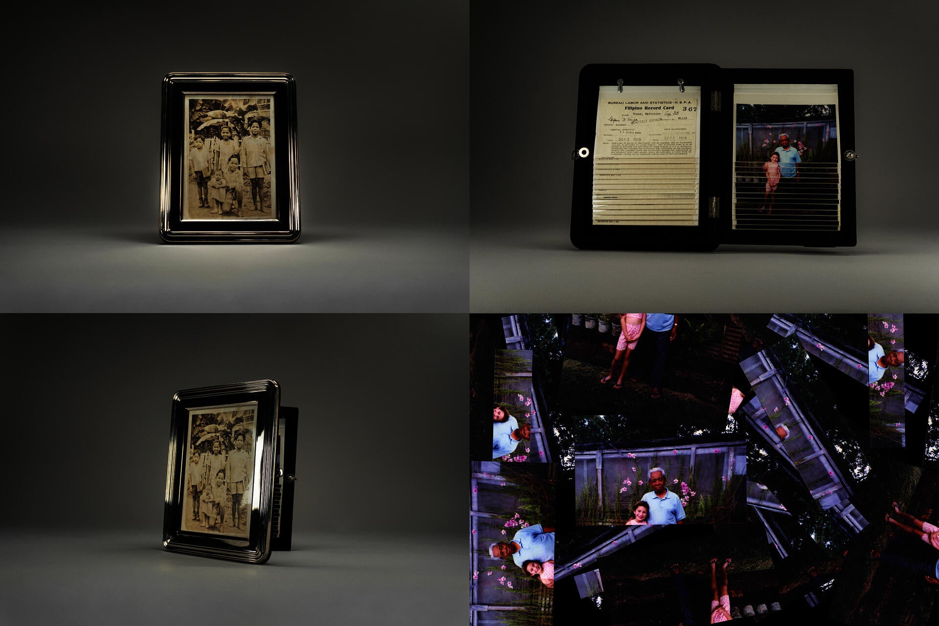 Archival display objects: vintage metal frames holding historical sepia photographs, hinged document case with record card, and scattered overlapping color prints arranged in tiled patterns.