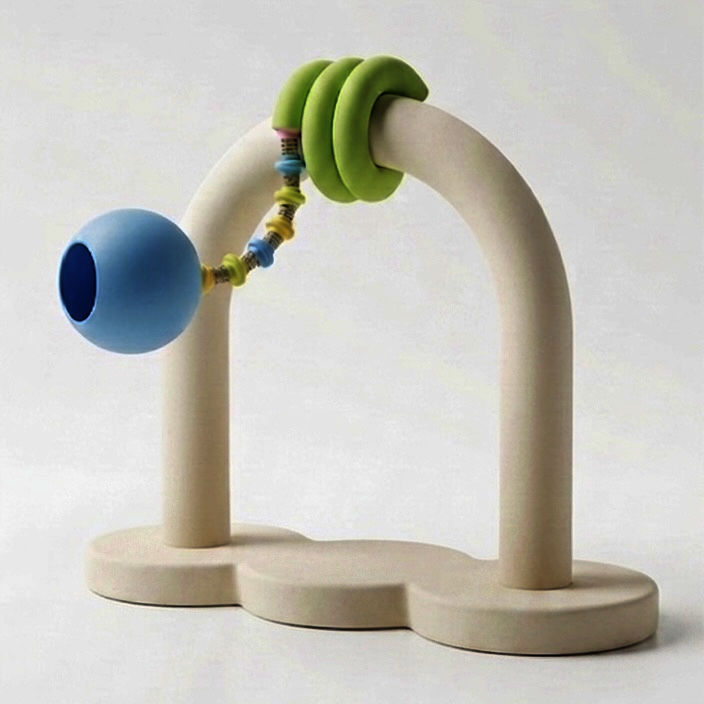 " An arched structure featuring a lighting fixture with a coiled green body and a blue sphere lampshade."