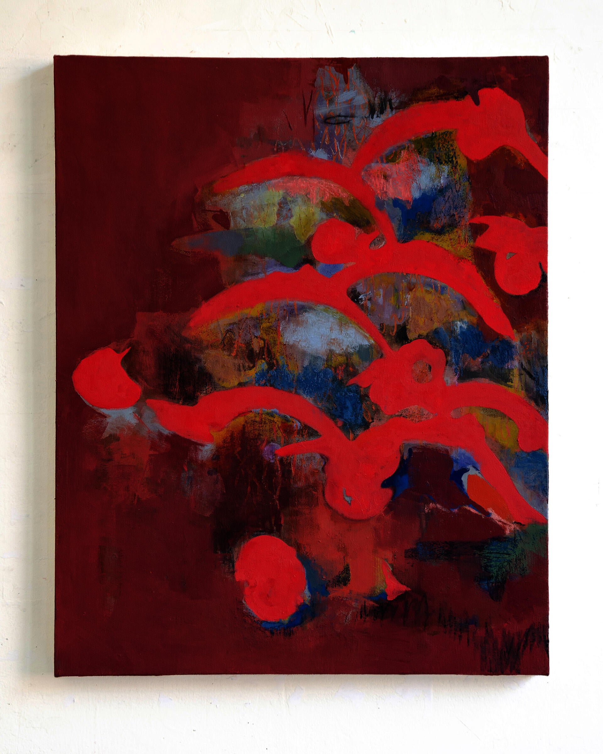 A group of abstract red curves interconnect on a deeper red field, where spots of blue, yellow, orange paint marks emerge. 