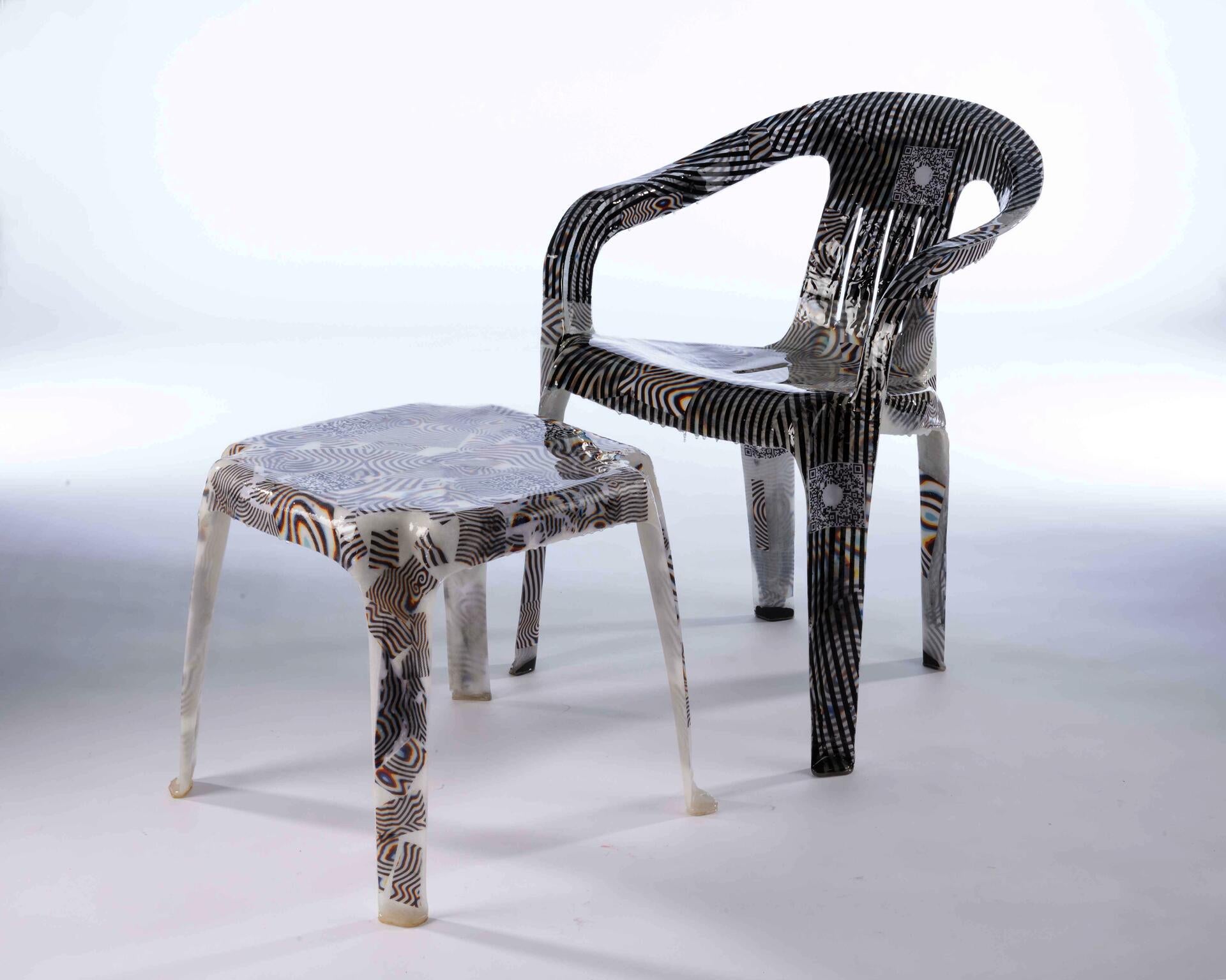 Glossy semi translucent fiberglass lawn chair and side table with funky psychedelic patterns embedded within.