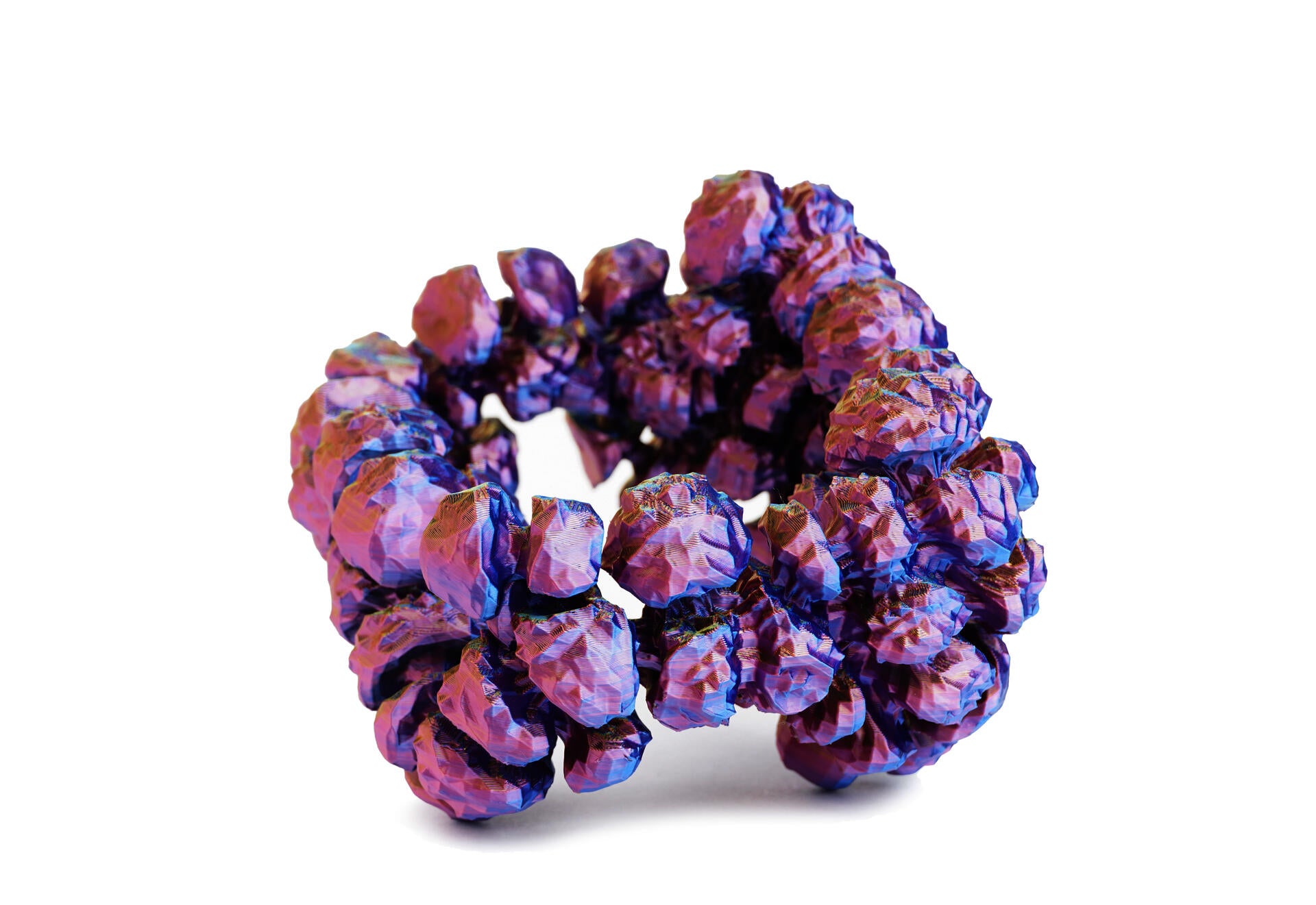 Iridescent purple and pink arm cuff built from clustered rounded volumes that swell outward in a band.