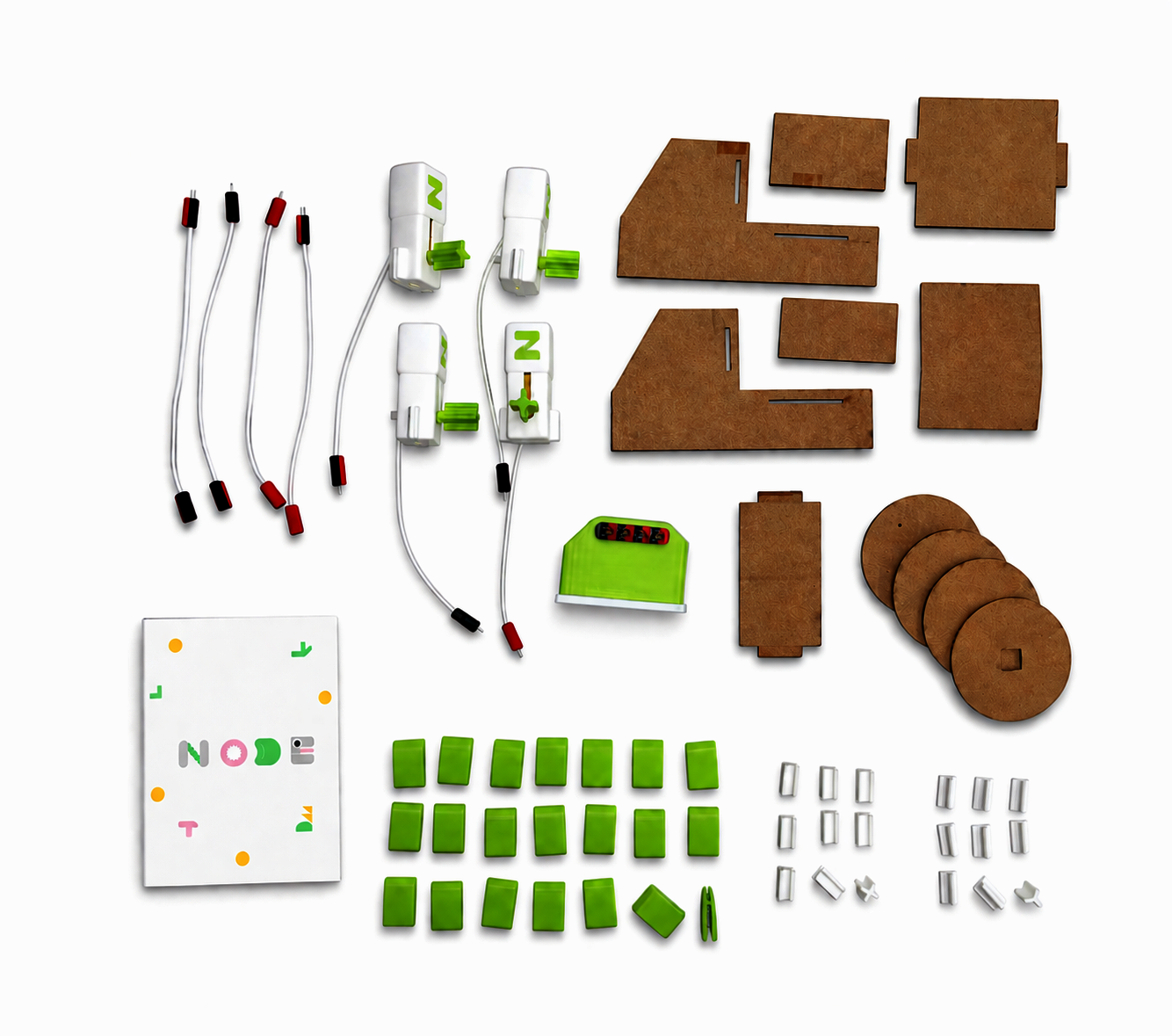 NODE kit components laid out on a table, including motors, cardboard parts, connectors, and instruction booklet.