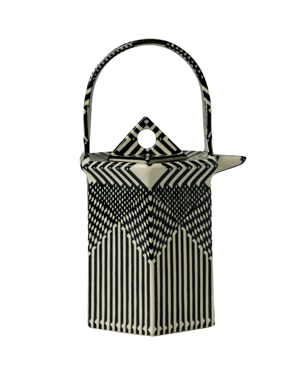 Black and white teapot with flat sides and a geometric design.