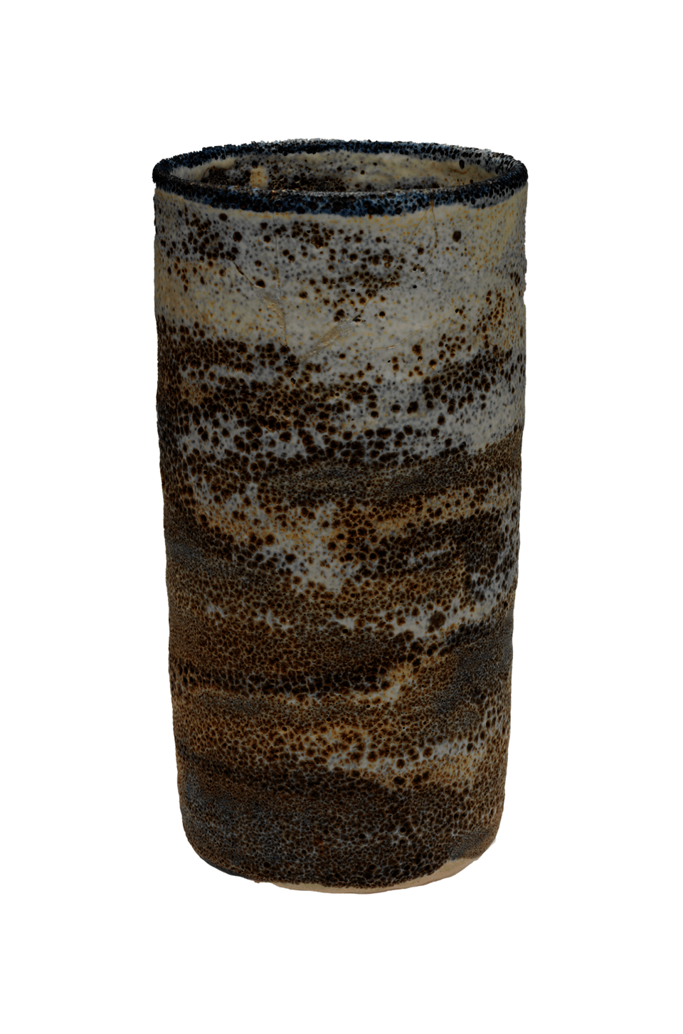 A tall, open, cylindrical vessel. It has a dark blue rim and layers of glaze in shades of brown and cream, with a patterning of dots.