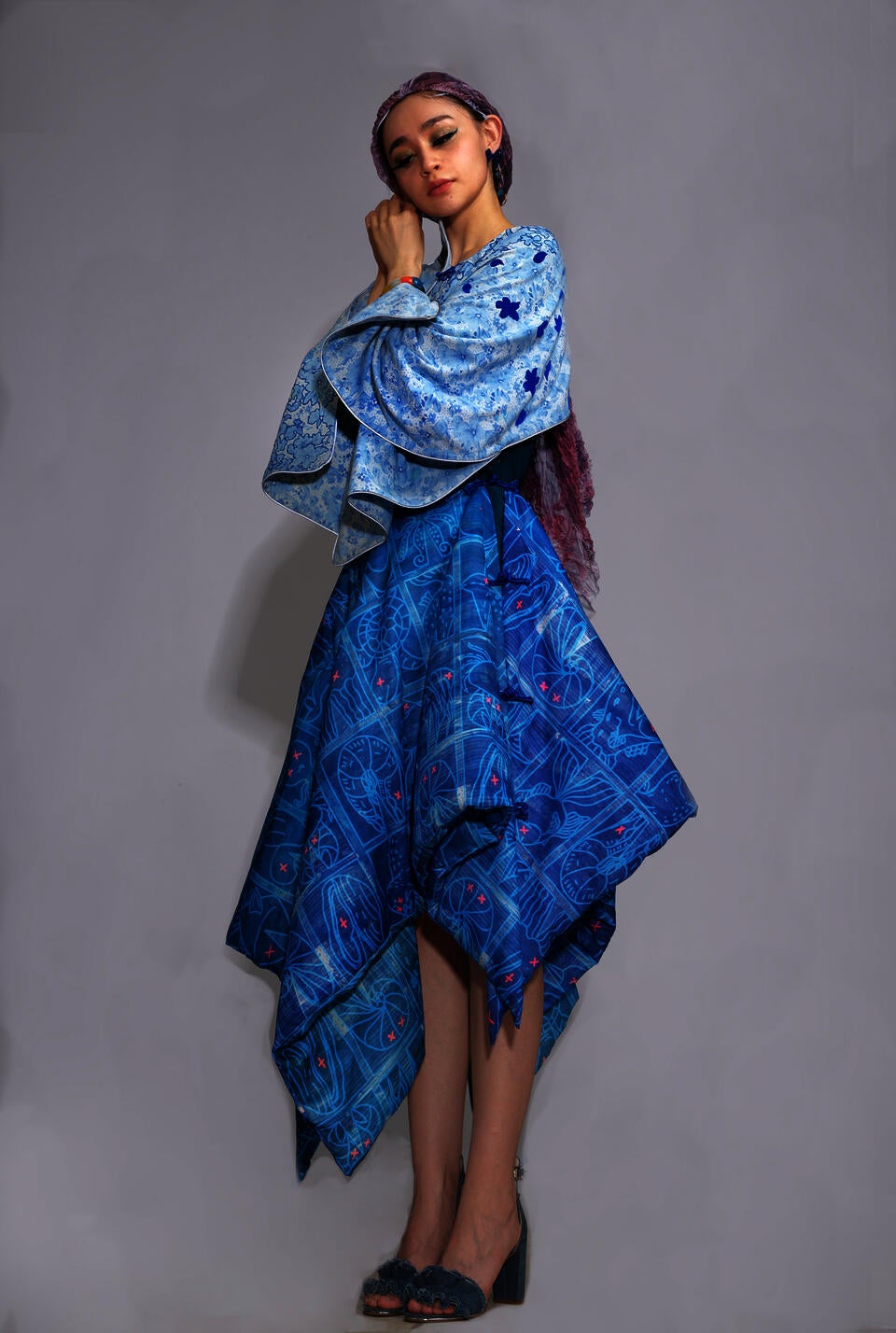  the recycled bed sheet cape and a wearable blanket skirt, with a dress wig