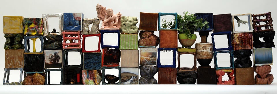 Collection of a variety of ceramic cube forms composed into wall shape. 