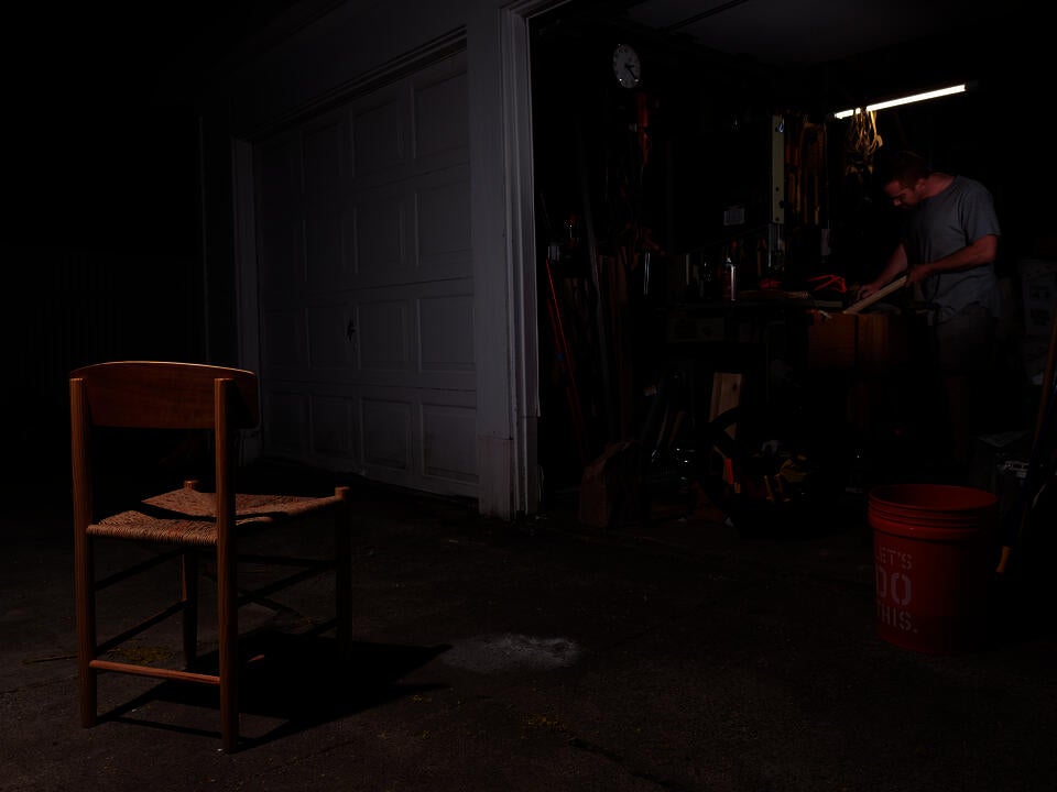 Image of Big Box Vernacular, an iteration of the J39 chair made entirely from tools and materials available at a home improvement center, in front of my garage, while I size tenons for another chair.
