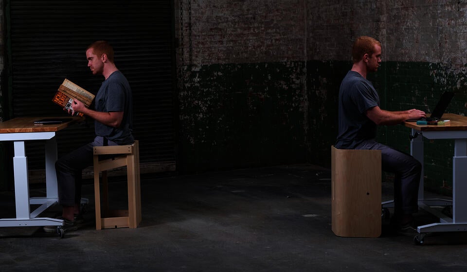 Image of me sitting at both versions of The Next One  in its upright position.
