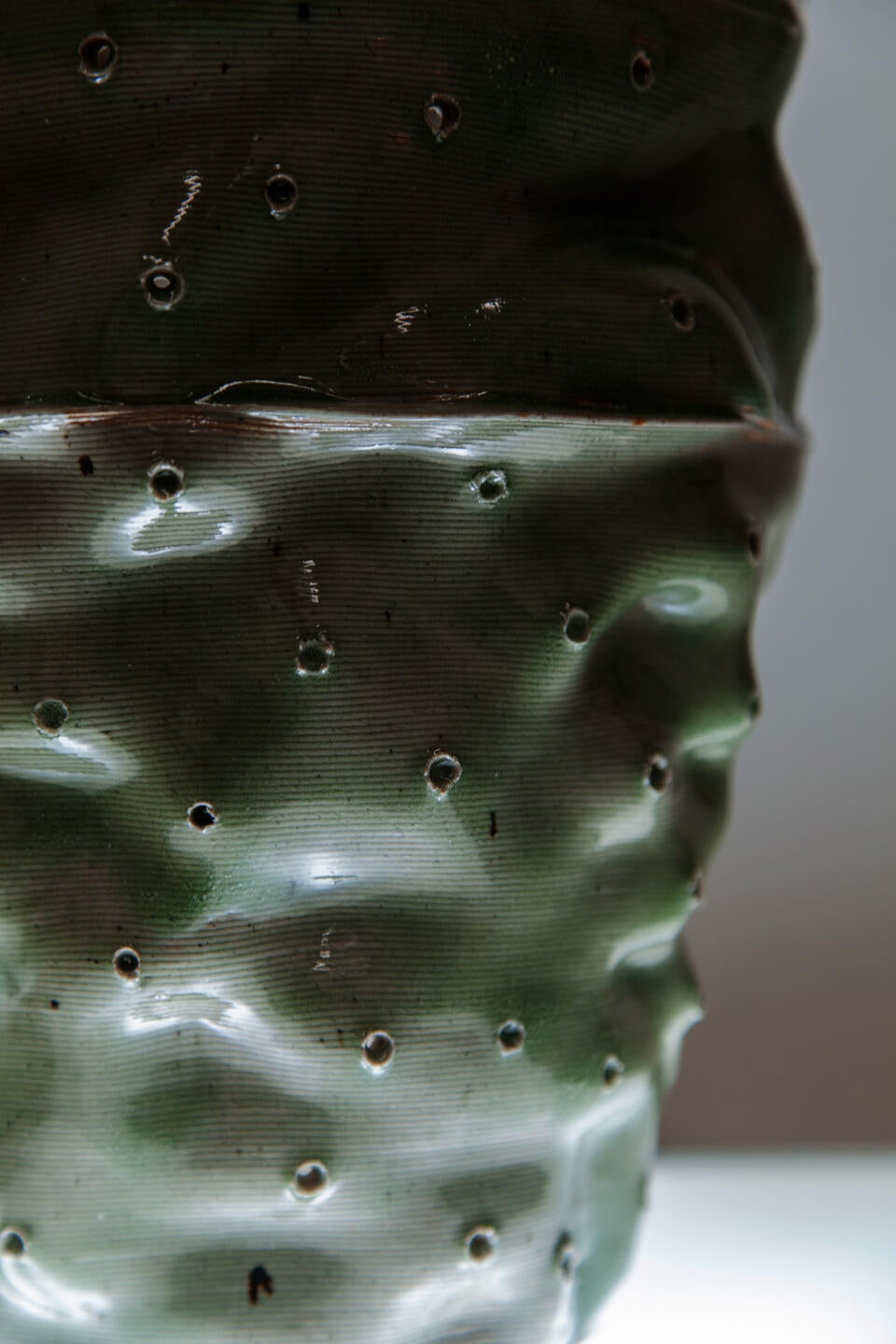 close up of ceramic tower glazed with beach sand