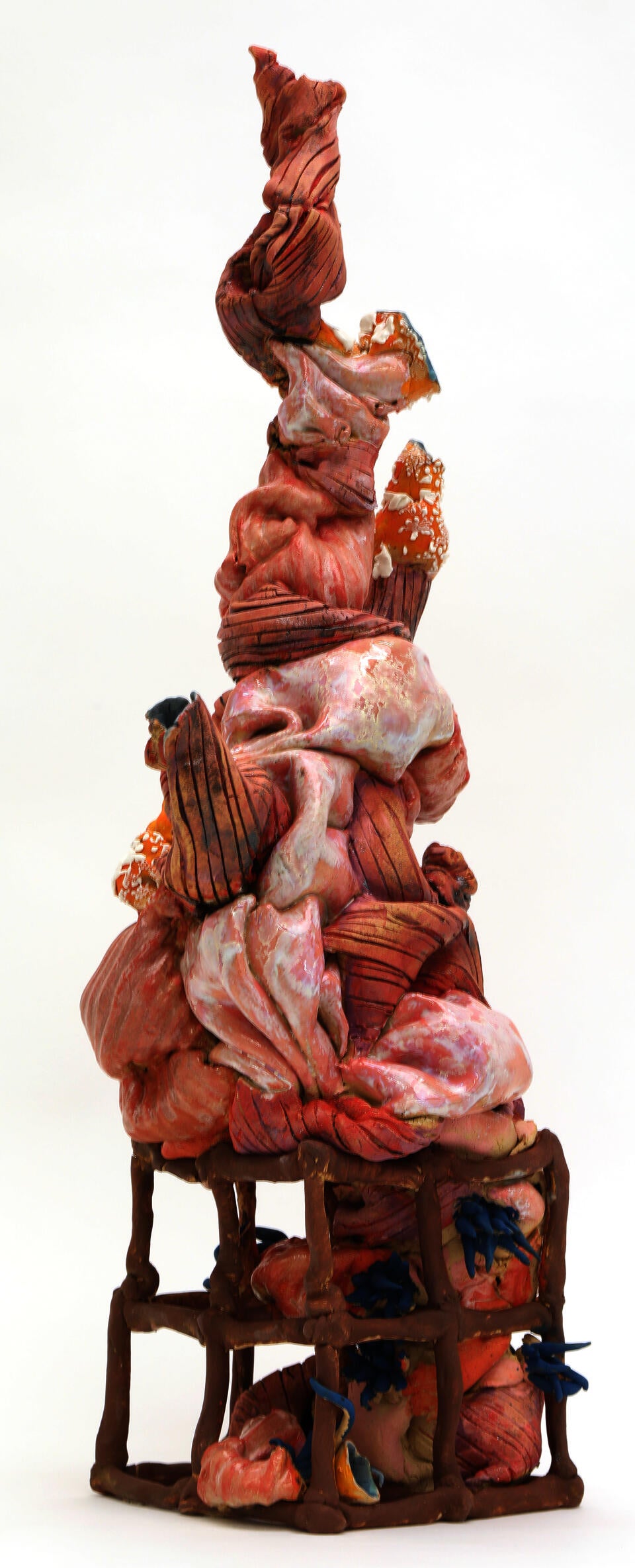 Abstract squishy-looking pink ceramic form that is vaguely tree-like. 