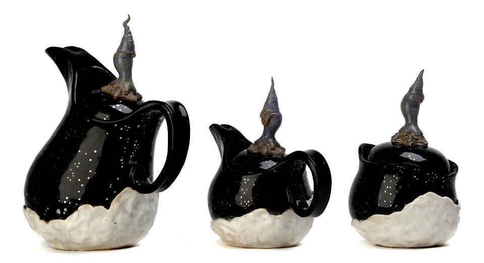 Set of 2 pitchers and a jar based on winter. Top is a gloss black with luster stars and the bottom is a satin white. 