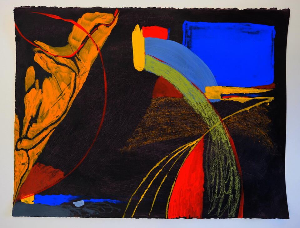 Photo of an abstract drawing in primary colors on grey 