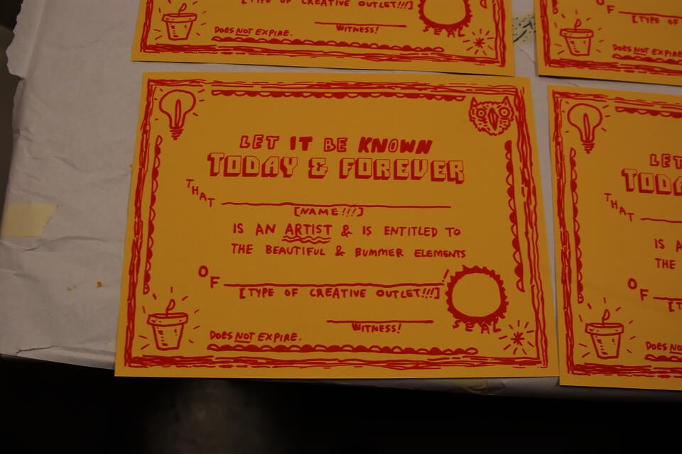 screenprinted hand-drawn certificates that say 'Let it be known today and forever that [name!!!] is an artist and is entitled to the beautiful and bummer elements of [type of creative outlet!!!]!'