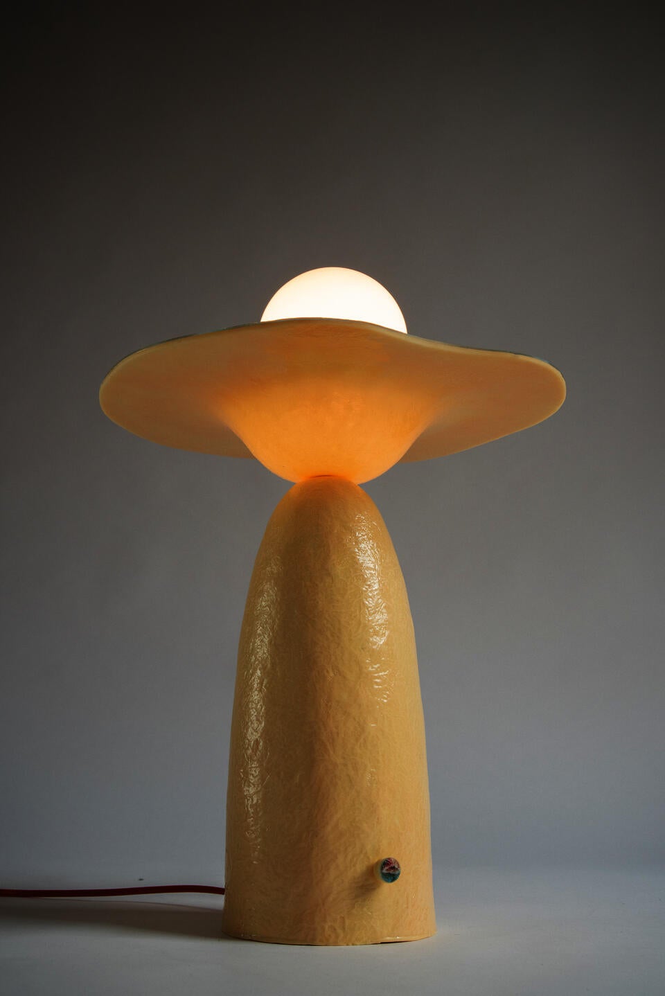 Detail image of the glowing underside of horizon lamp.