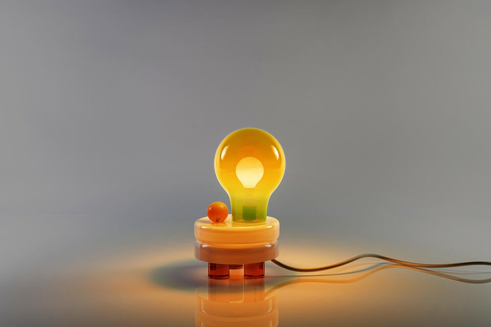 A modern night lamp with hand blown parts and tricycle solid glass foot 