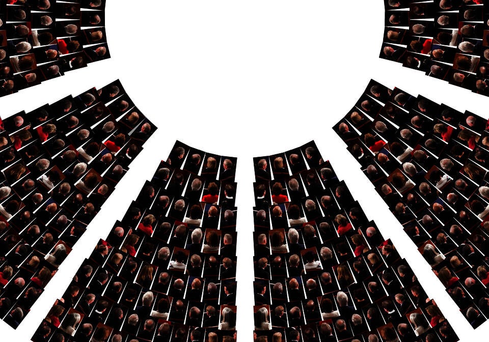 This image shows the cutout image of the politicians' heads facing away and is arranged based on the seating plan of the chamber of the United States House of Representatives.
