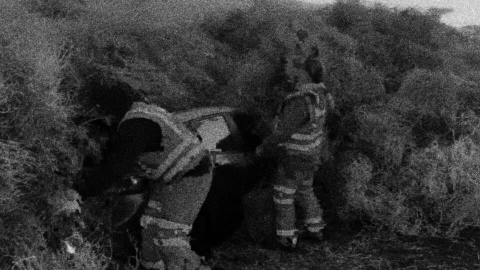 A screenshot from newsfootage covering "tumblegeddong" where 30 foot high waves of tumbleweeds swallowed cars. 