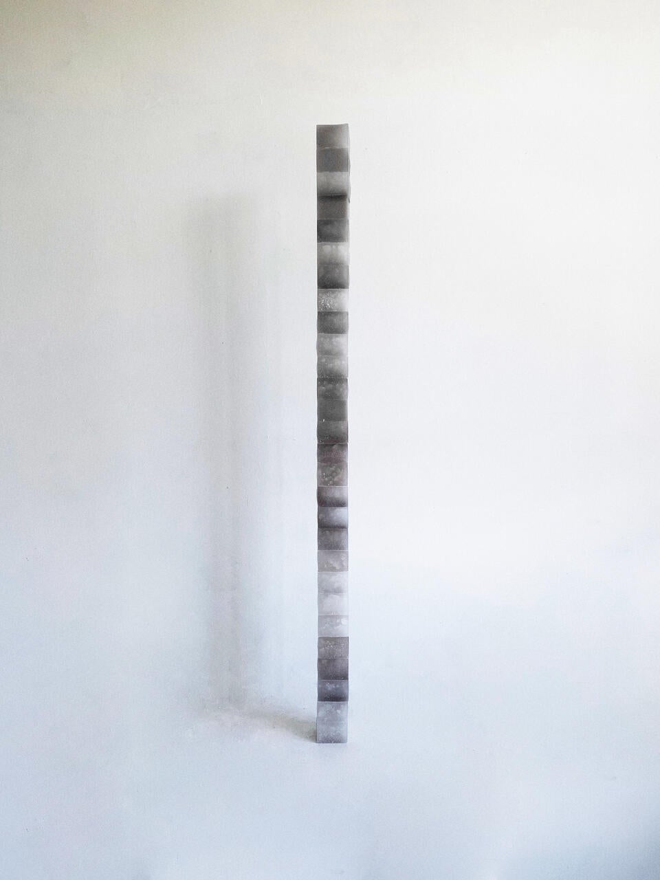 A stack of grey tone wax cube