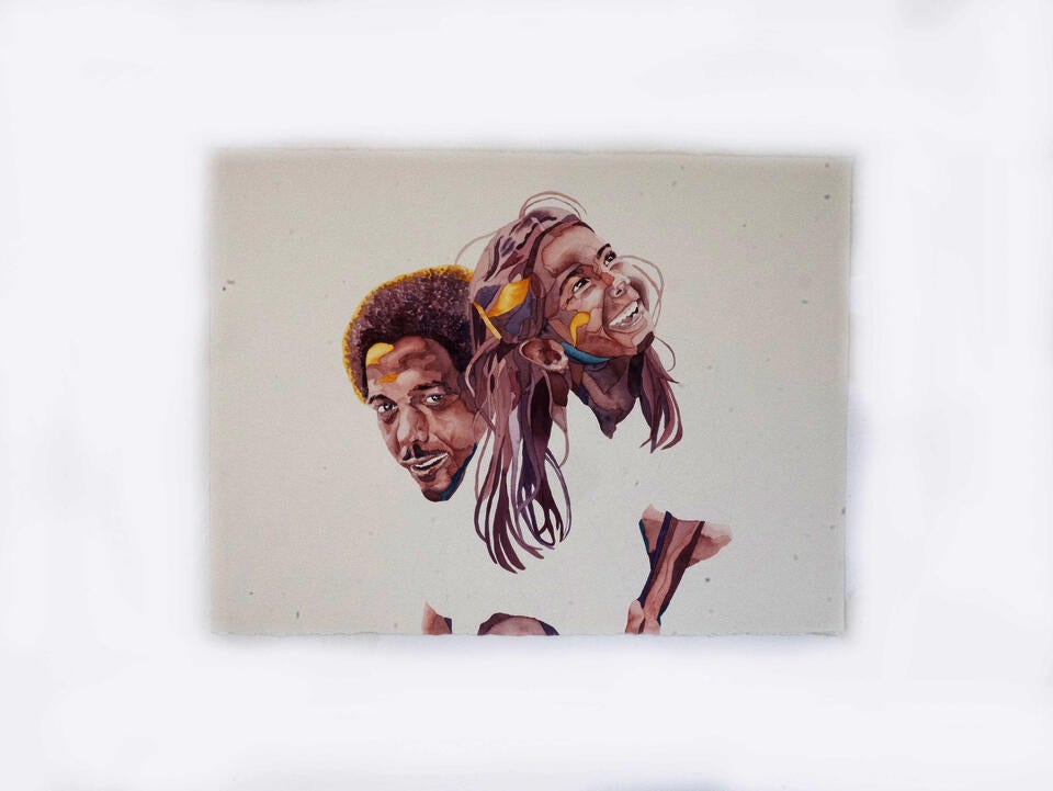 Portrait of an Uncle lifting his niece up over his shoulder, both smiling.