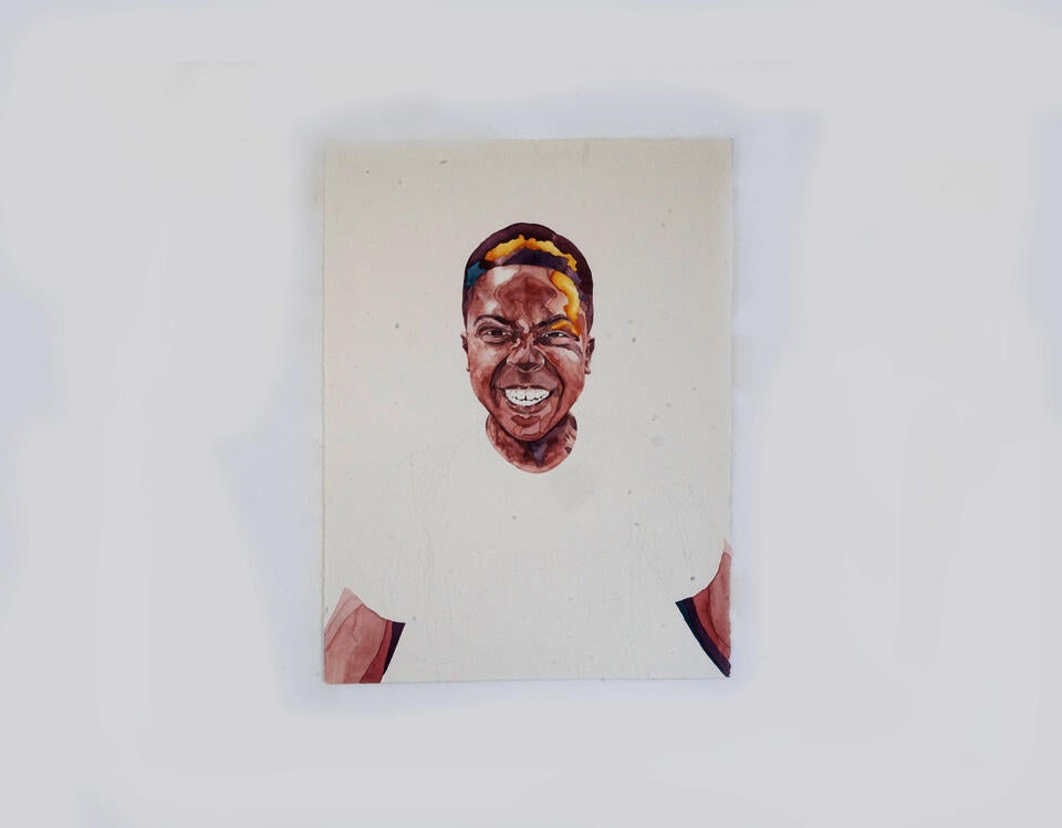 Portrait of a young boy making a smiling silly face. 