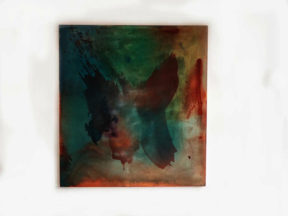An abstract painting on stretched canvas in washes of color- yellowfins, blue, green- with a muted form in the middle resembling butterfly wings.