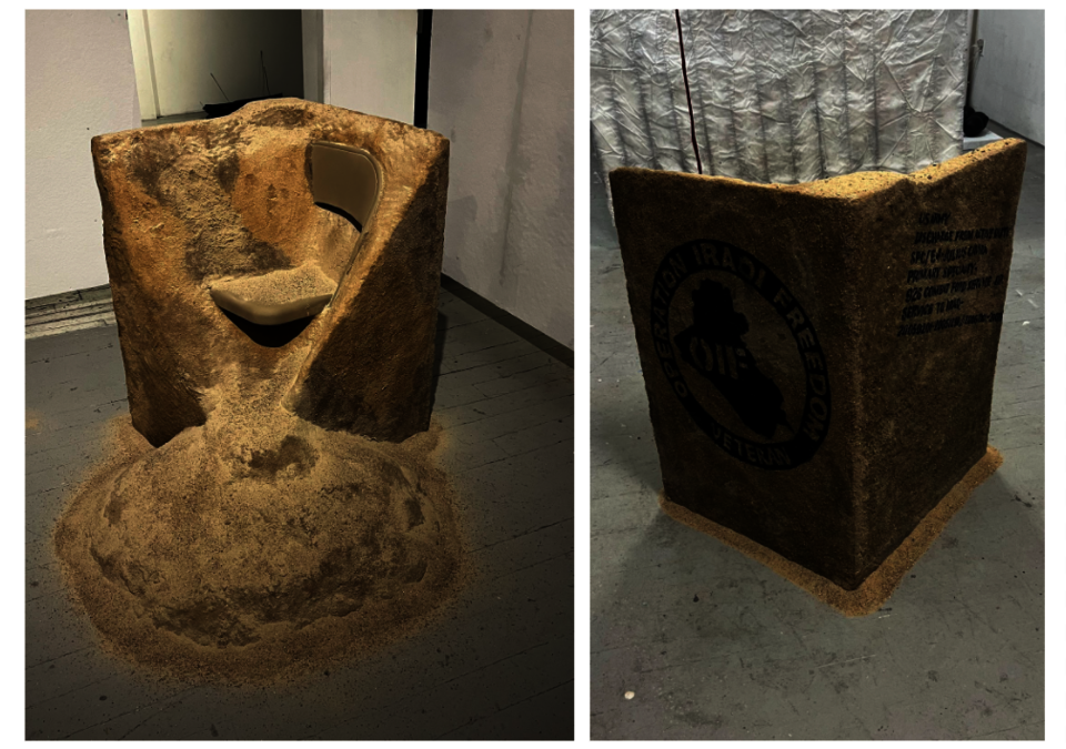 Postwar Sandbox PTSD Therapy is literally a tall cube composed of sand, and embedded in it is a used metal folding chair partly exposed. 