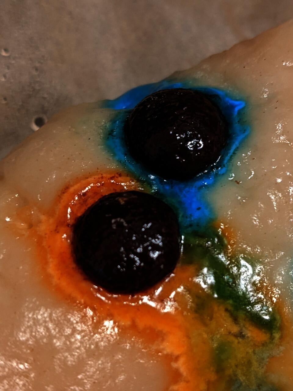 Colorful melted candies on top of steamed flour dough