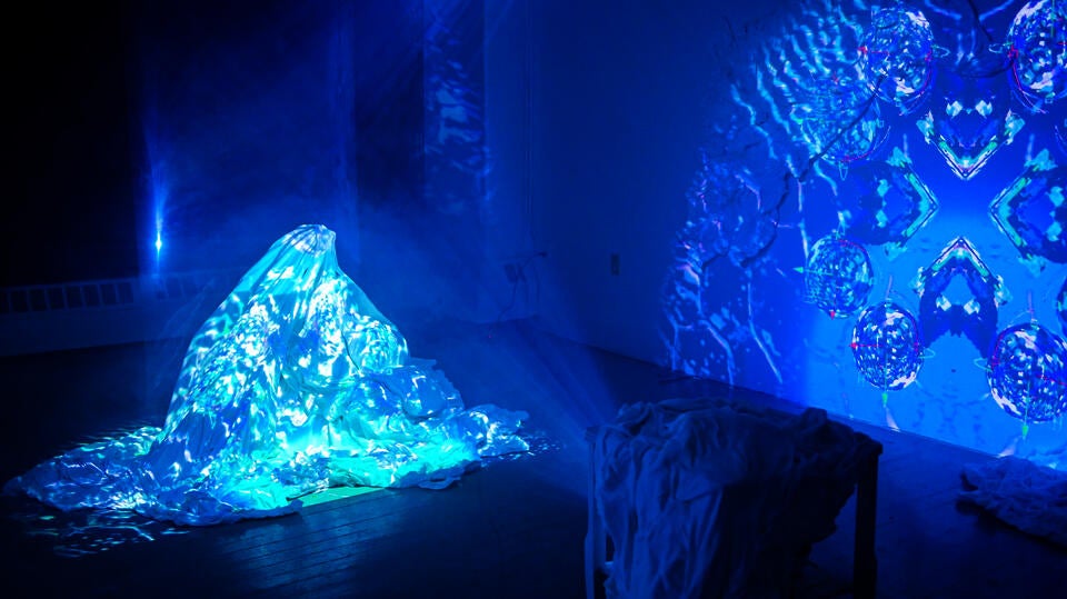  Photogrammetry animation of Cherenkov radiation from RINSC nuclear reactor projected on an installation of bedsheets, salt, and melatonin.