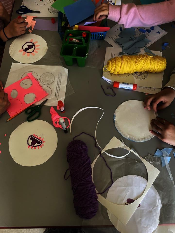 Students work on radial designs inspired by the crochet artist Xenobia Bailey. 
