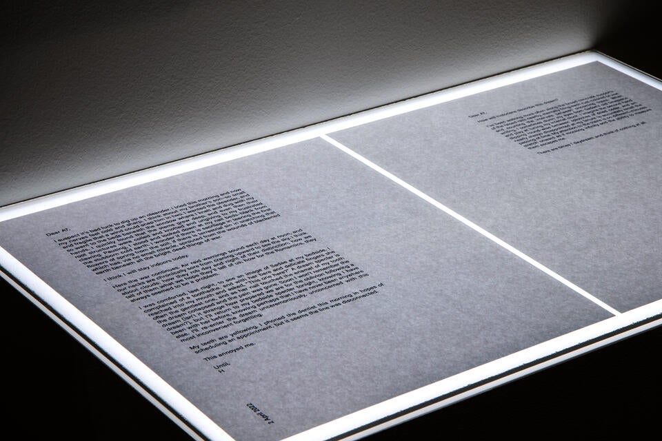 A detail photograph of two letters placed on a Lightbox.