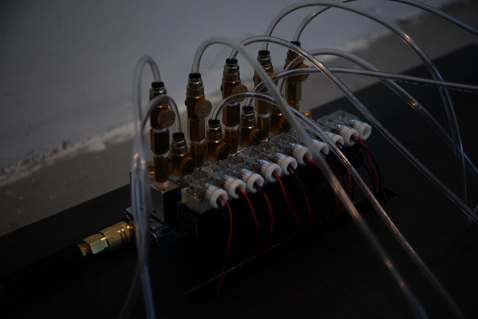 Pneumatic solenoid manifold with vinyl tubing.