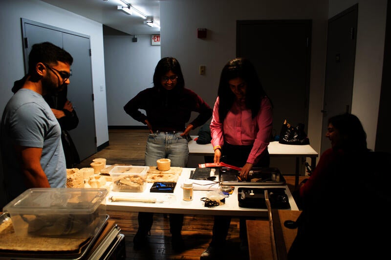 A group of participants selecting designed mycelium materials and tools for prototyping 