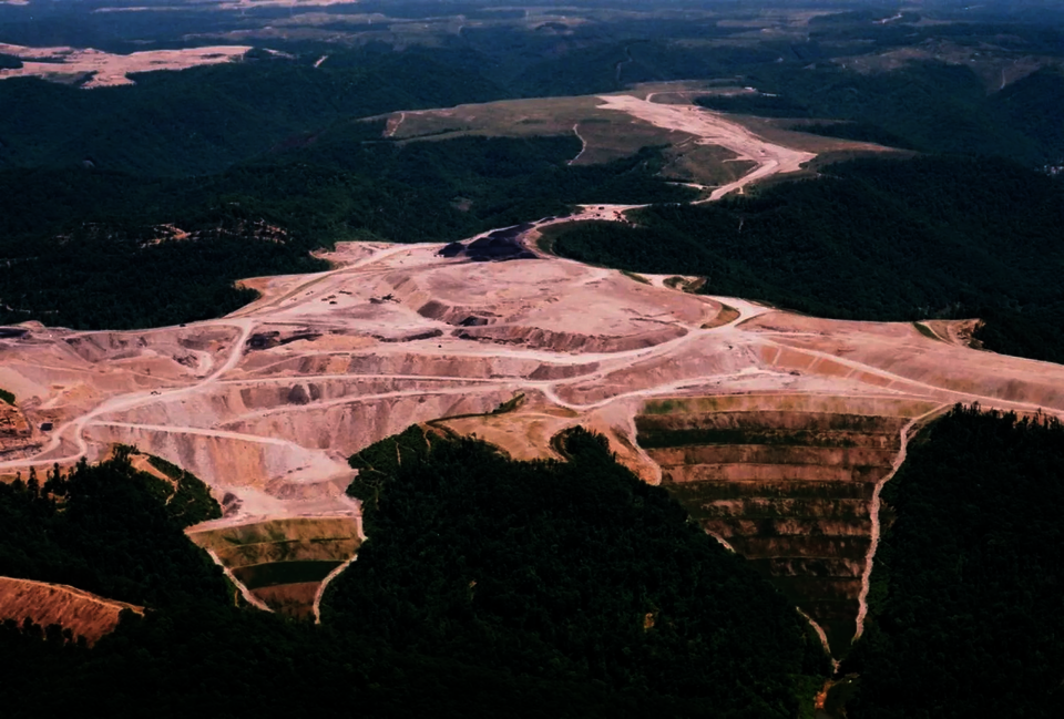 Mountain top leveled for coal mining with terraced valley fills