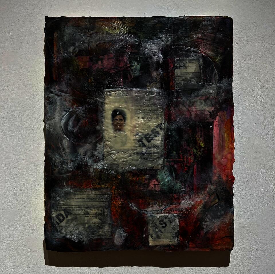 A layered painting with visible areas and others with accumulated material 