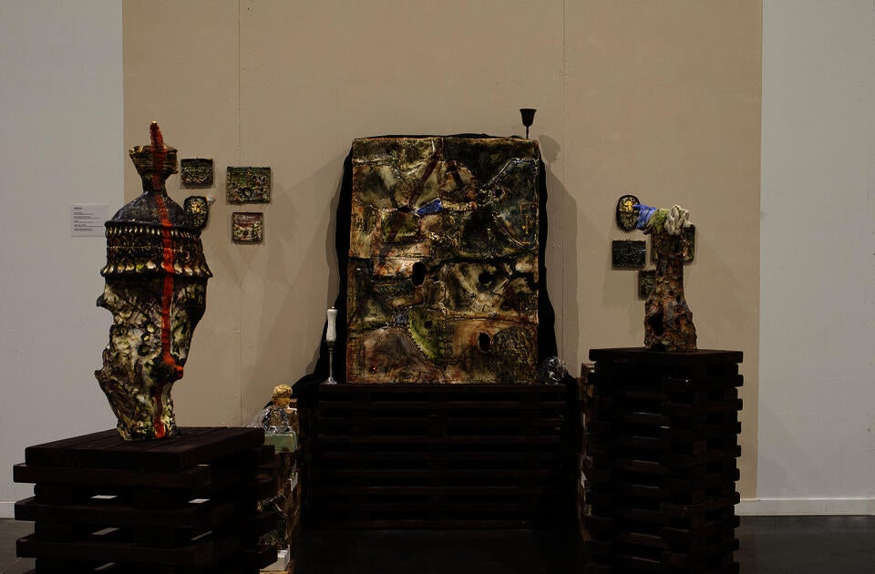 installation of big porcelain box with multiple ceramic objects to the sides