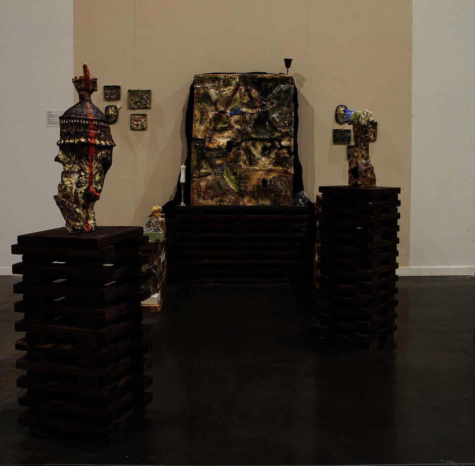 installation of big porcelain box with multiple ceramic objects to the sides